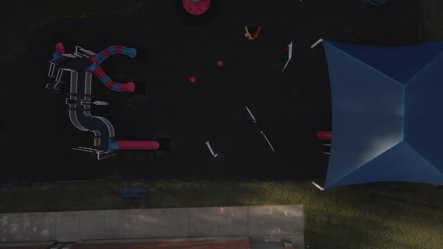 Bright blue shade structure over playground area