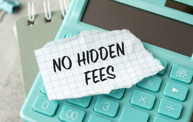 A calculator with a piece of paper on it that says No Hidden Fees