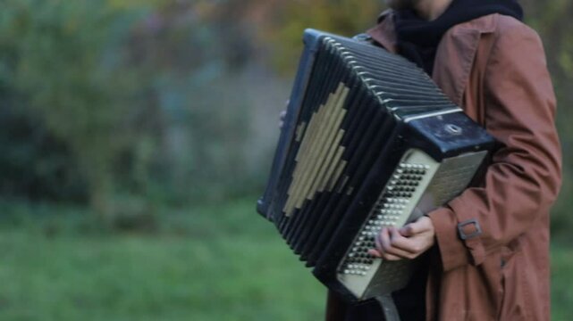 playing the accordion close-up, male hands