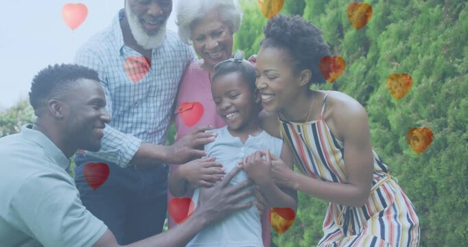 three-generation family smiling with heart overlays starting floating celebrating family love