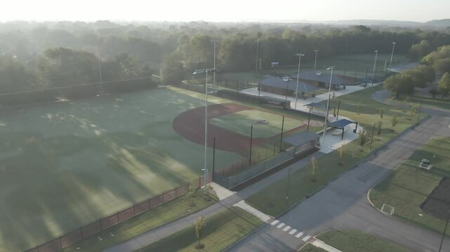 Morning-lit sports complex with fields