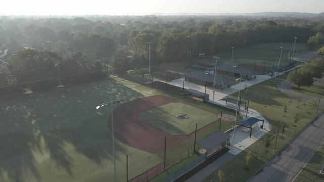 Vacant baseball and tennis fields open