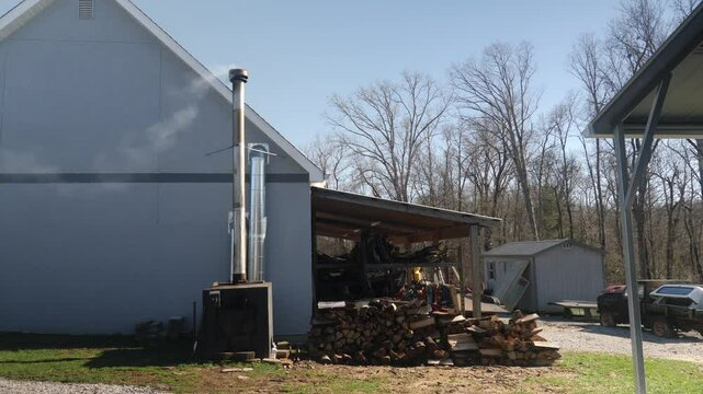 Rural wood storage workshop with smoke