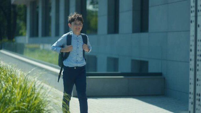 Schoolboy Leaps From School Steps After a Day of Learning