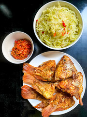 a plate of several crispy fried fish