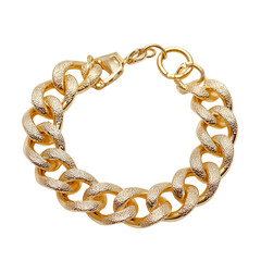 Obraz premium Gold curb chain bracelet