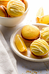 Homemade round lemon cookies. French sweet yellow cookies macarons.