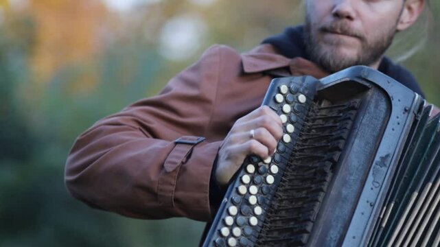 playing the accordion close-up, male hands