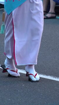 KOENJI, TOKYO, JAPAN - AUGUST 2023 : View of AWA ODORI FESTIVAL in summer season. Traditional dance festival of Tokushima prefecture. Vertical video.