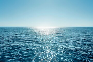 Vast ocean expanse under a clear sunny sky with glistening reflections on the water