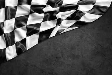Checkered flag on grey wall