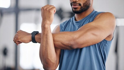 Muscular Man Stretching Arms Wearing Fitness Tracker.
