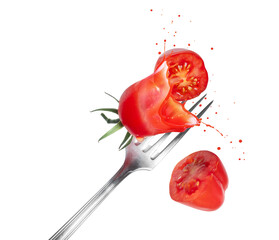 Fresh tomatoes pierced by fork with juice splashes