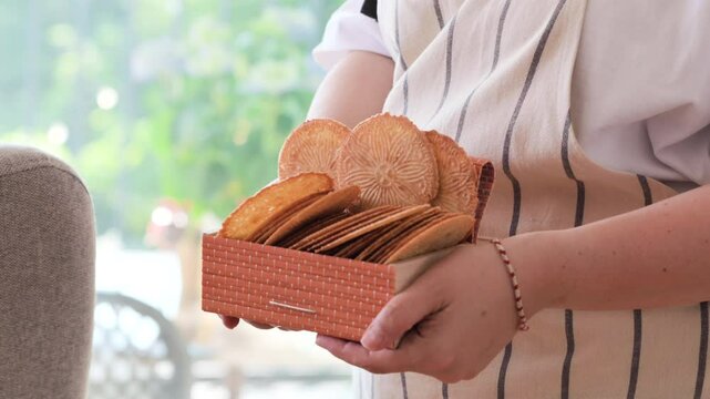 Bricelets thin, crispy Swiss wafers, traditionally served with coffee or raclette. Artisanal, patterned biscuits from western Switzerland, symbol of heritage and culinary craft.High quality 4k footage