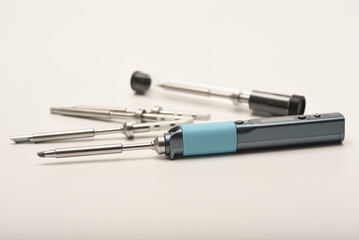 New electronic soldering irons with stingers. Modern tin soldering tools.
