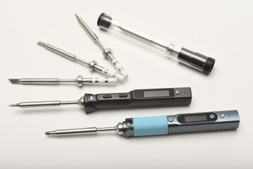 New electronic soldering irons with stingers. Modern tin soldering tools.