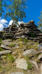 Devil's Hillfort complex on sunny summer day. Iset Park, Iset village, Sverdlovsk region, Russia. Hiking and walking.  Vertical image