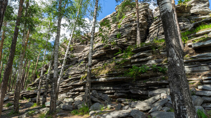 Devil's Hillfort complex on sunny summer day. Iset Park, Iset village, Sverdlovsk region, Russia. Hiking and walking