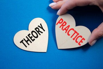 Theory or Practice symbol. Concept word Theory or Practice on wooden hearts. Businessman hand....