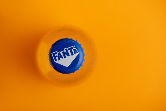 Lviv, Ukraine - June 19, 2025: Top-down view of a Fanta bottle cap on an orange background.