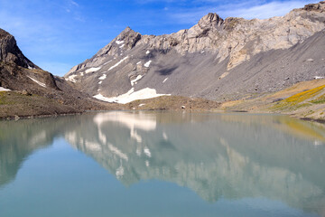 Mountain panorama with lake Lac de la Forcla and summit Tete aux Veillon in Swiss Alps, Switzerland