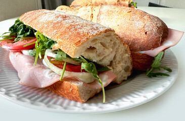 Close-up of baguette sandwich with italian martadella sausage