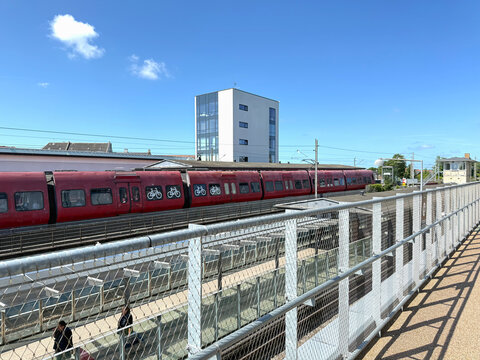 Fototapeta Red long train at the station platform