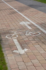 White painted markings for pedestrian and bicycle paths on the street