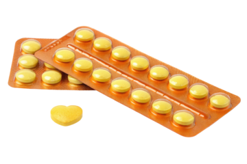 Yellow heart shaped pill and blister pack of yellow pills isolated on transparent background