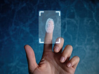 Finger touching a futuristic fingerprint scanner, scanning fingerprint for identification.