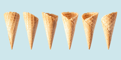 Various ice cream cones isolated on blue background. Banner design.