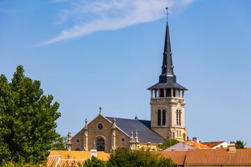Fototapeta premium Saint-Martin-de-Vertou Church in the village of L’Île-d’Olonne seen from the salt marshes