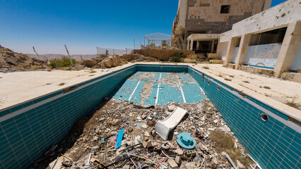 Abandoned Pool and Building in Ruins
