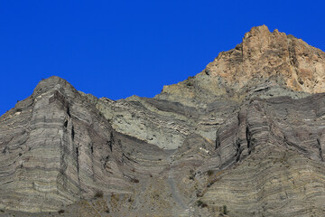 Image of rock formations lined up in layers.