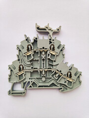 Cross-section of industrial electrical terminal block on white background..