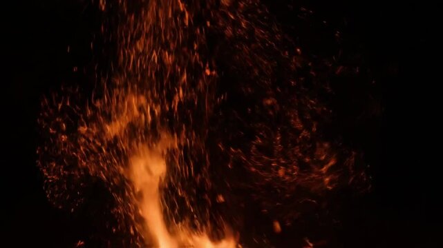 Fiery Orange and Red Particle Rain - A vibrant shower of fiery orange and red particles and sparks raining down against a dark background, perfect for adding intensity to action or dramatic scenes.