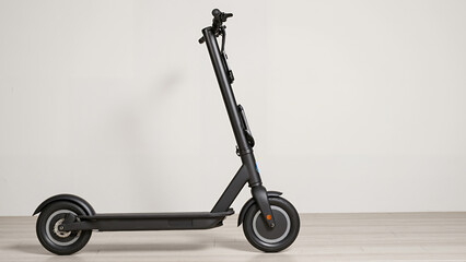 Electric scooter in minimalist design on light-colored background  