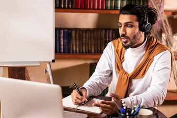 Male Teacher Having Online Lecture At Laptop Making Video Call Teaching Distant Students And...