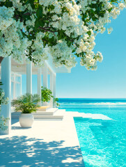 Luxurious poolside scene with white flowers and potted plants overlooking the ocean