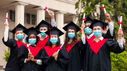 Diverse International Students With Diplomas Celebrating Graduation, happy multiracial group of...