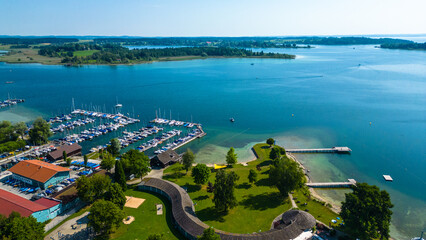 Aerial view of Prien am Chiemsee, a charming Bavarian town on the shore of Lake Chiemsee. Captured...