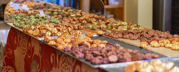 Different color of cookies in a bakery shop at Riquewihr, Alsace, France, winery