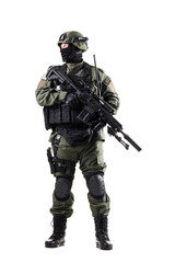 Military special forces soldier fully armed in tactical gear in action