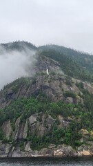 Statue of the Blessed Virgin in the Saguenay Fjord in the fog