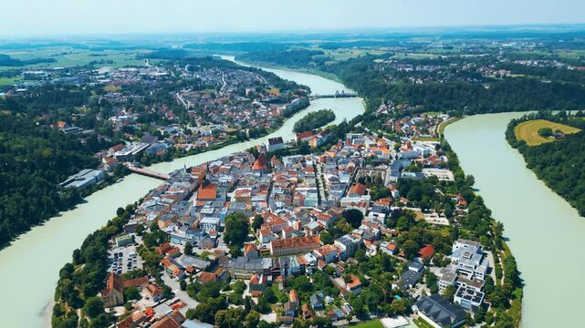 Wasserburg am Inn captured from above, uniquely nestled in a dramatic river bend. This Bavarian town enchants with colorful buildings, medieval charm, and scenic natural surroundings