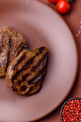 Grilled beef steak meat with salt and pepper. Beef steak grilled on a barbecue