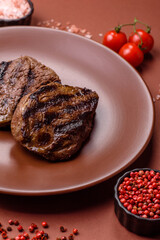 Grilled beef steak meat with salt and pepper. Beef steak grilled on a barbecue
