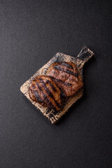 Grilled beef steak meat with salt and pepper. Beef steak grilled on a barbecue