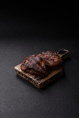 Grilled beef steak meat with salt and pepper. Beef steak grilled on a barbecue