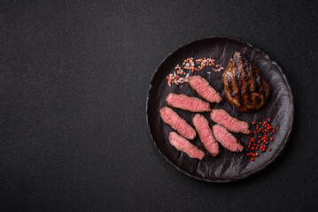 Grilled beef steak meat with salt and pepper. Beef steak grilled on a barbecue